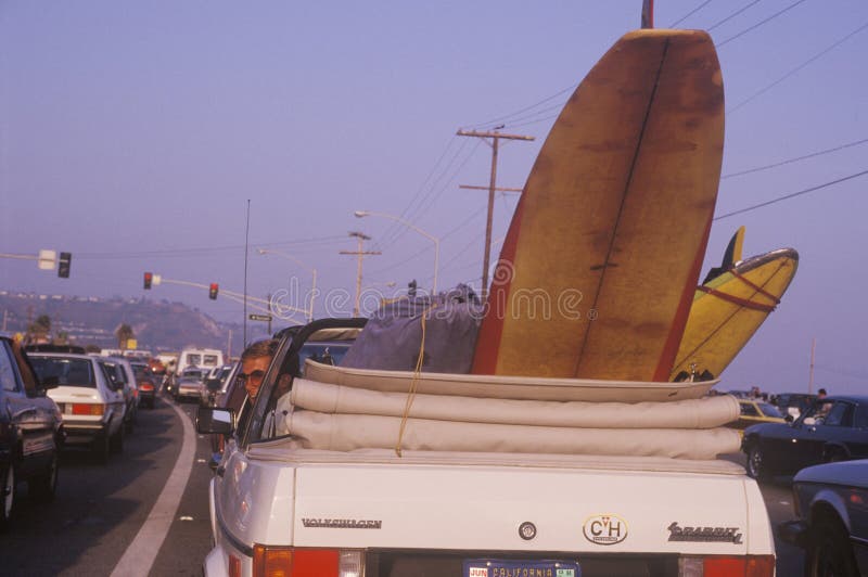 Surfboard in back of convertible, Sunset Beach, Malibu, CA. Surfboard in back of convertible, Sunset Beach, Malibu, CA