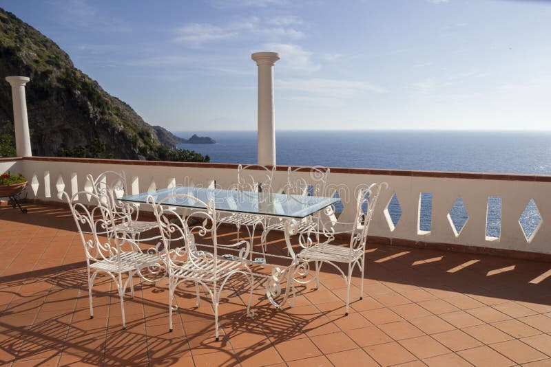 Table on the Amalfi coast stock image. Image of chair 261666115