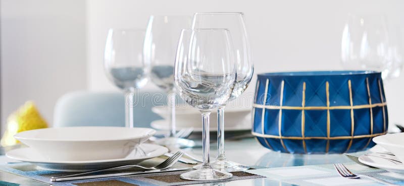 Table appointment setting at restaurant fragile wine or water glasses and plates