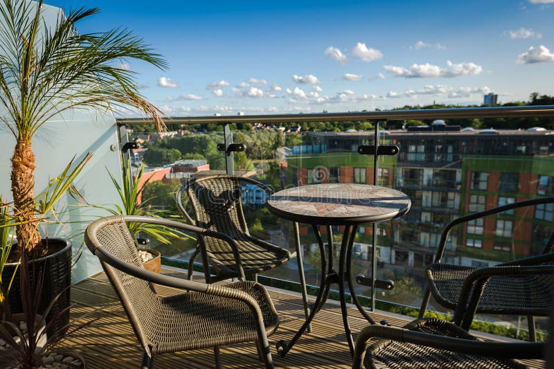 Table and Chairs on Balcony Stock Photo Image of armchair, high 65802764