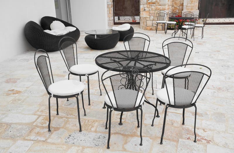 Table and chairs in empty cafe.