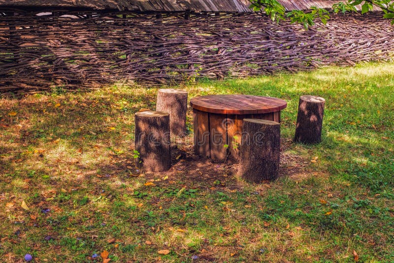 Table with Chairs in the Garden Stock Photo - Image of sunny, front