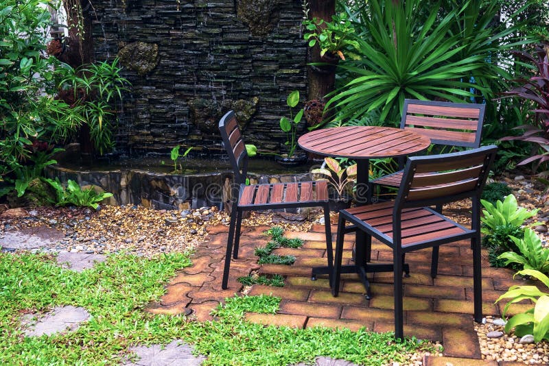 Table and Chairs Set in the Beautiful Outdoor Garden Stock Image Image of landscape, furniture