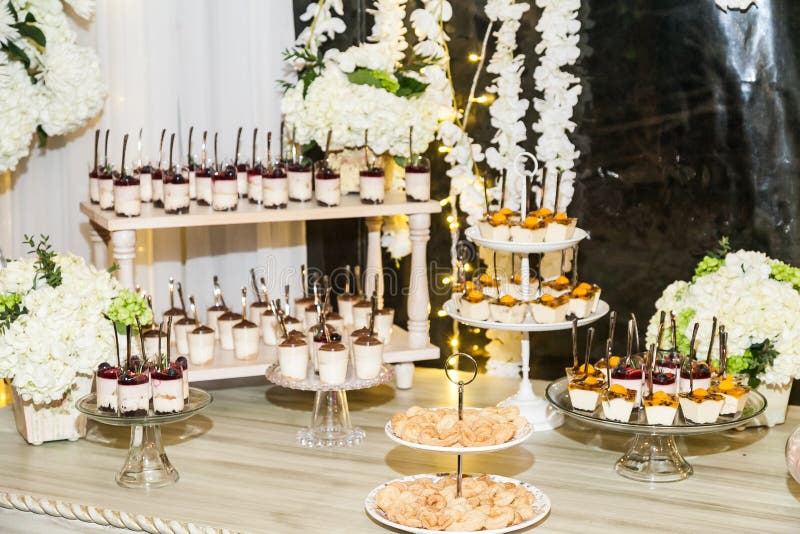 Delicious wedding reception candy bar dessert table stock photo