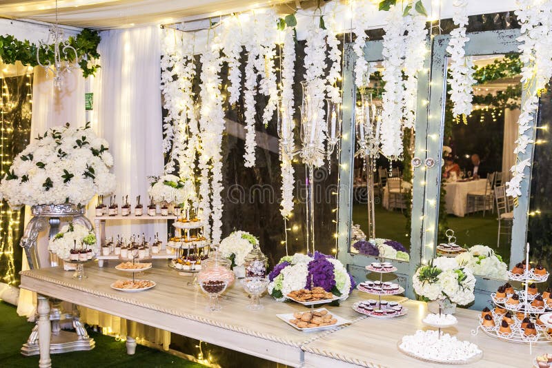 Delicious wedding reception candy bar dessert table stock photo