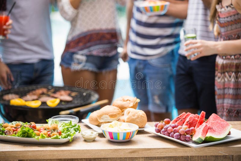 Table laid with food for outdoors barbecue party royalty free stock photos Table laid with food for outdoors barbecue party royalty free stock photos