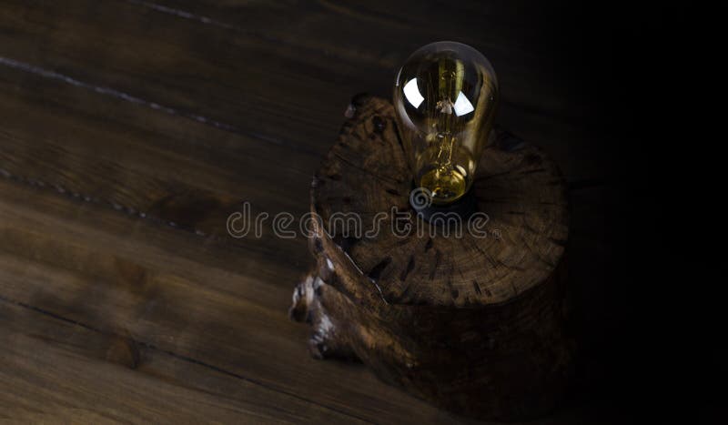Table lamp. Edison. Light from the lamp. On the table. royalty free stock image
