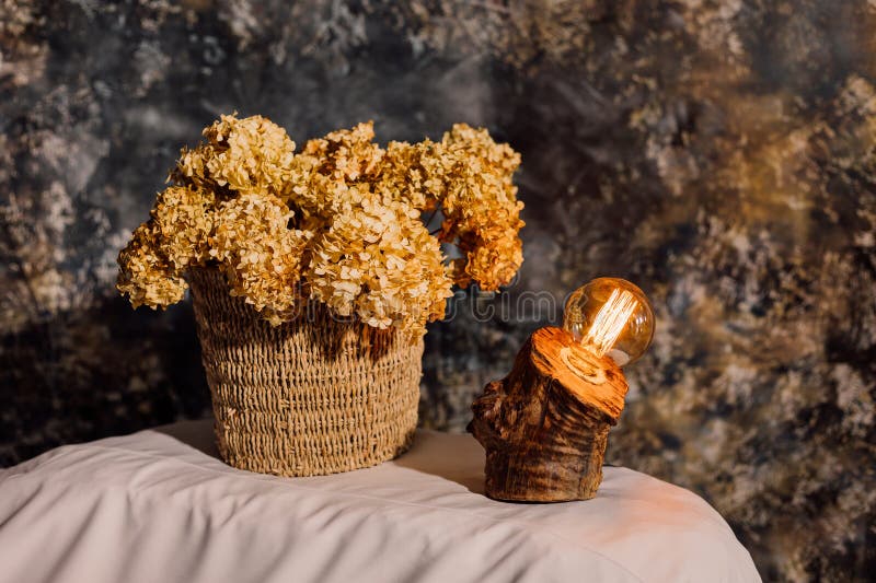 Table lamp made of wood. Edison electric lamp. Incandescent lamp. stock image