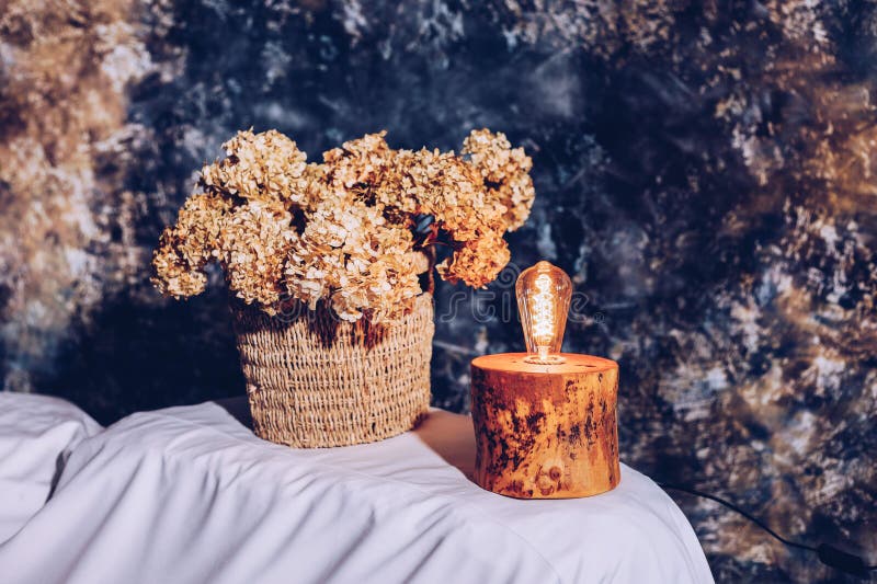 Table lamp made of wood. Edison electric lamp. Incandescent lamp. stock photography