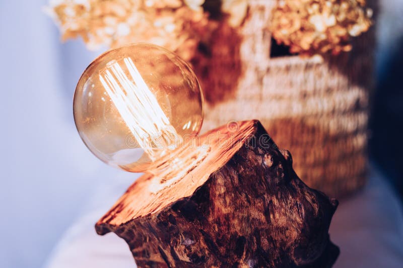 Table lamp made of wood. Edison electric lamp. Incandescent lamp. royalty free stock image