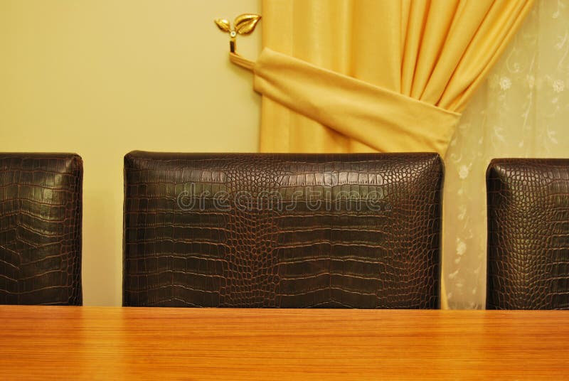 Table and leather chairs stock photo. Image of fracture 29075240