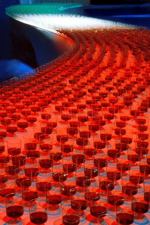 Table with Many Glasses of Wine Forming the Italian Flag Stock Photo