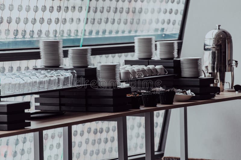 A Table in a Modern Hotel with Dishes Ready To Serve Guests Stock Image