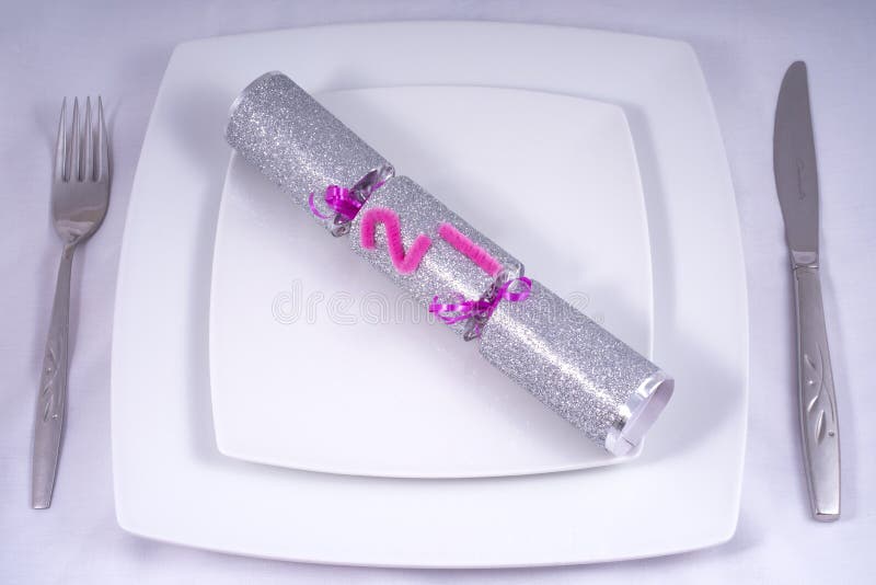 Table Place Setting with a Traditional Cracker for a 21st royalty free stock photo