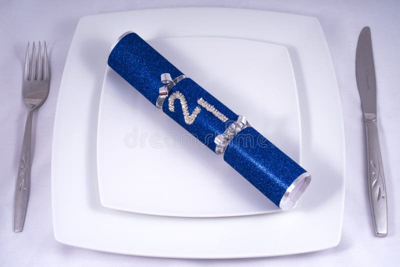 Table Place Setting with a Traditional Cracker for a 21st stock photography