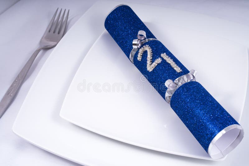 Table Place Setting with a Traditional Cracker for a 21st royalty free stock images