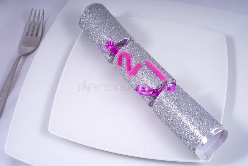Table Place Setting with a Traditional Cracker for a 21st stock photo