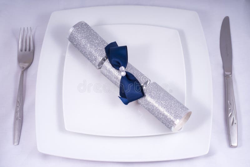 Table Place Setting with a Traditional Cracker royalty free stock image