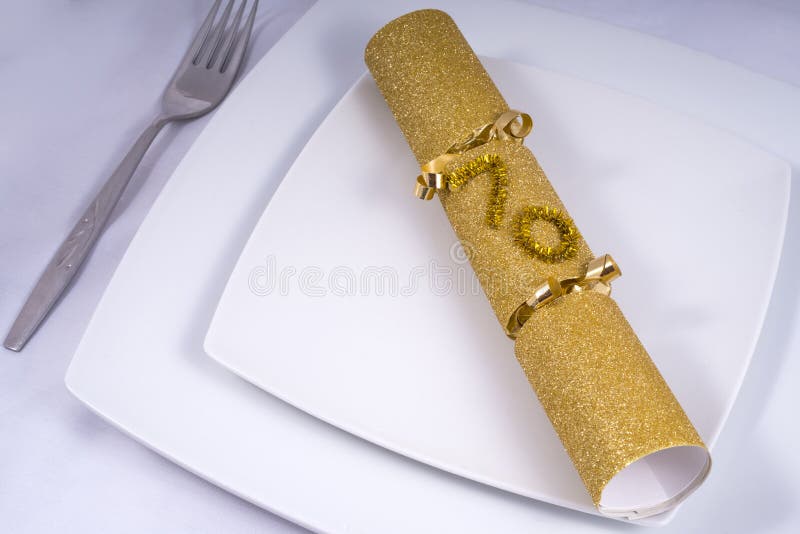 Table Place Setting with a Traditional Cracker for a 70th stock photography
