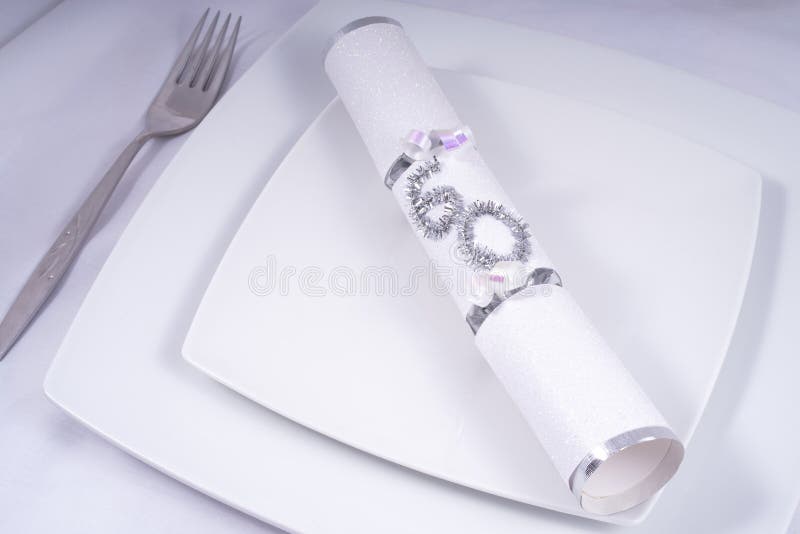 Table Place Setting with a Traditional Cracker for a 60th royalty free stock photography