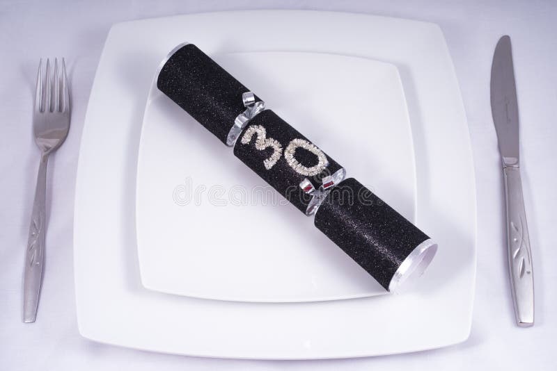 Table Place Setting with a Traditional Cracker for a 30th royalty free stock photography