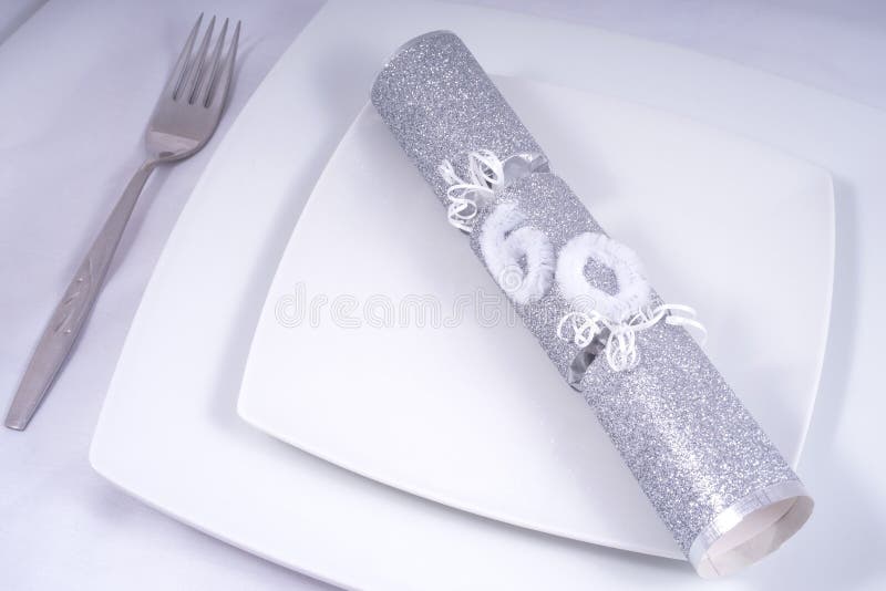 Table Place Setting with a Traditional Cracker for a 60th stock image