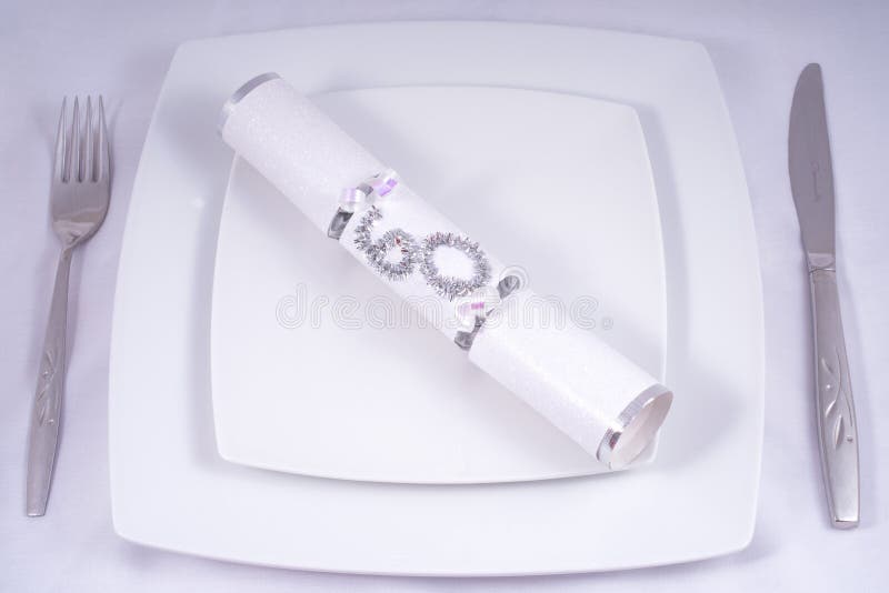 Table Place Setting with a Traditional Cracker for a 60th royalty free stock image