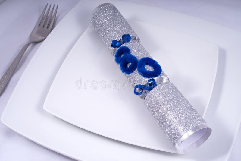 Table Place Setting with a Traditional Cracker for an 80th royalty free stock photo