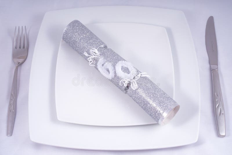 Table Place Setting with a Traditional Cracker for a 60th royalty free stock photos