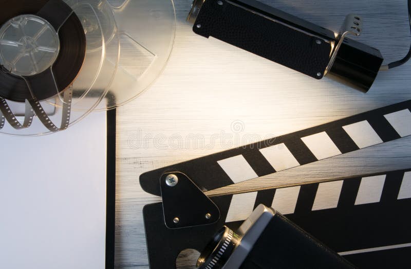 On the table by the projector illuminated a place for a label, laid out the items, take to shoot, tablet to record royalty free stock images