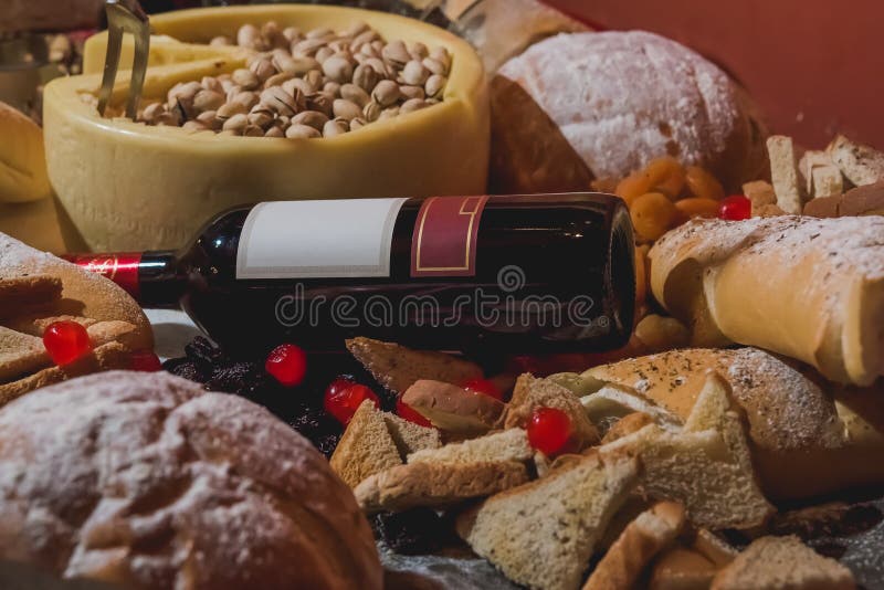 Table Set with Various Types of Breads, Cheese, Wine and Dried Fruits