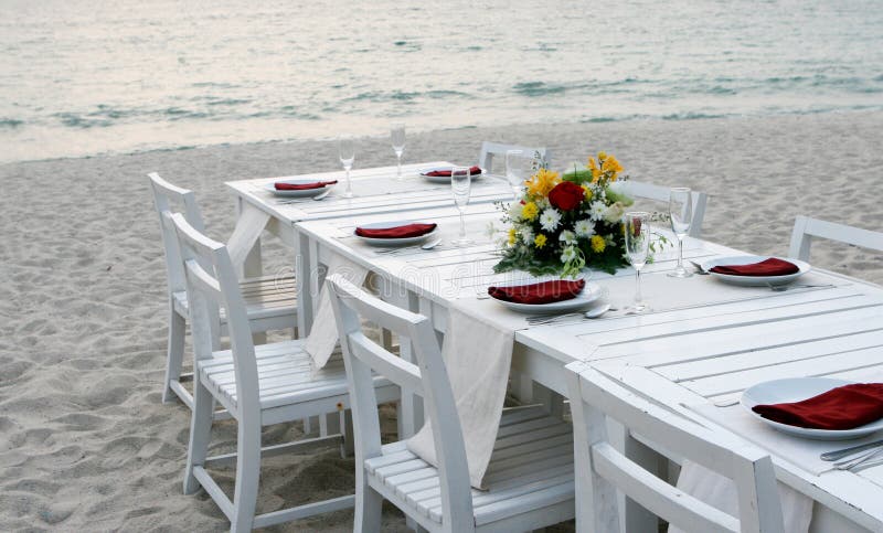 Elegant table setting at a wedding reception on the beach. Serene beach atmosphere stock images, royalty-free photos and pictures