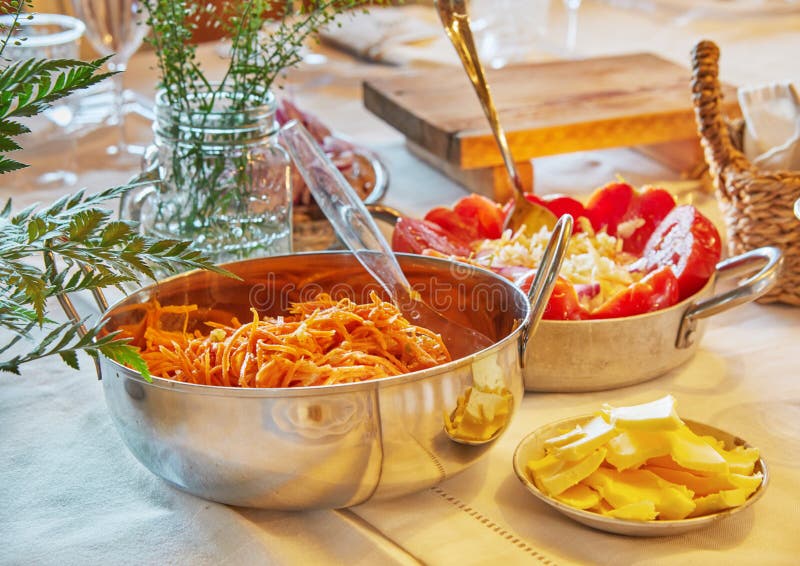 Table Setting with Fermented Tomatoes and Korean Carrots Stock Photo