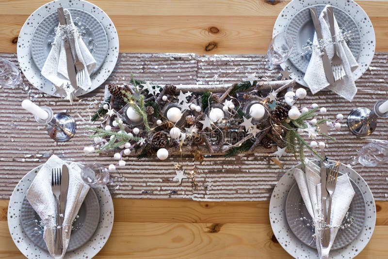 Table Setting with Gift Boxes and Holiday Decorations Top View