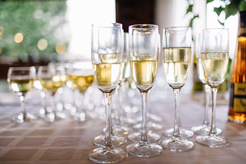 Festive Table Setting with Champagne. Champagne Glasses Close Up Stock
