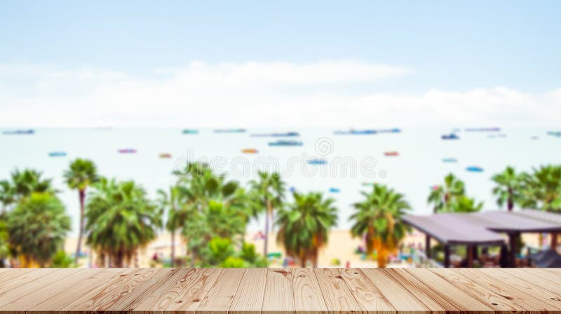 Table Summer Background with Top Deck on View Beach Sand Sea and Palm Tree with Blue Sky,Wooden on Island Ocean Water Backdrop