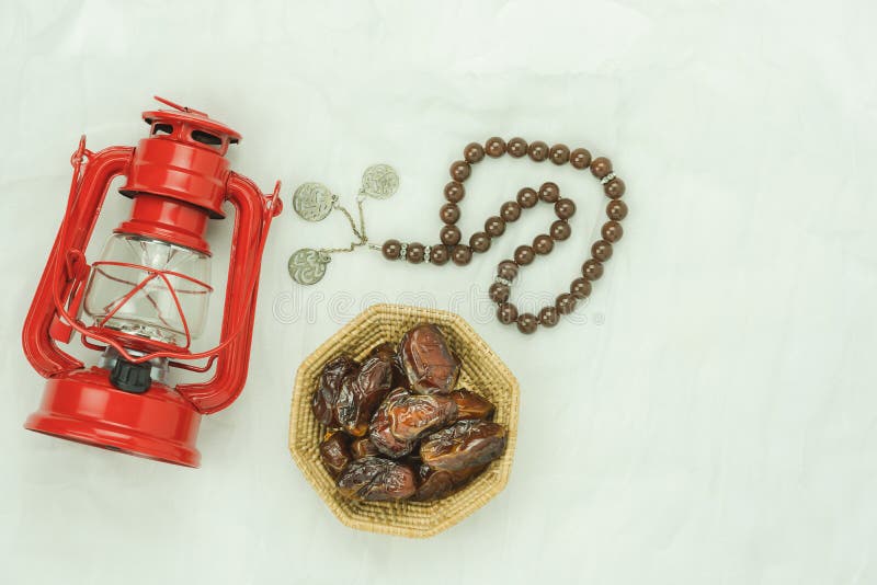 Table top view aerial image of decoration Ramadan Kareem holiday background.Flat lay essential objects dates with rosary & red stock photography Table top view aerial image of decoration Ramadan Kareem holiday background.Flat lay essential objects dates with rosary & red stock photography