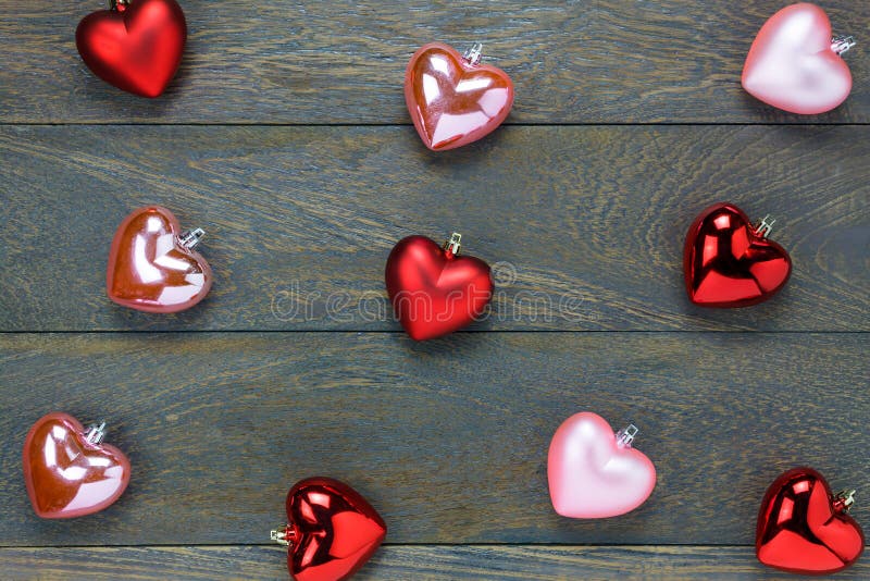 Top view red and pink heart shape pattern on wooden background. stock image