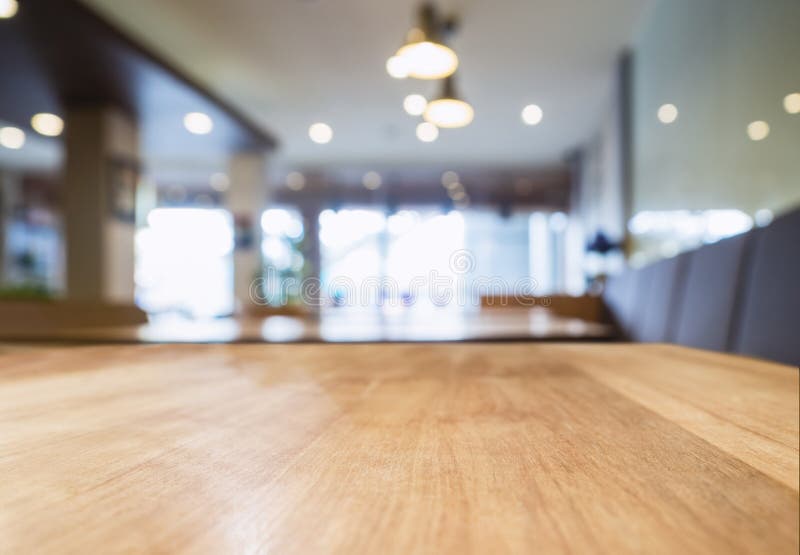 Table top Wooden counter Interior lighting Cafe restaurant Blur background