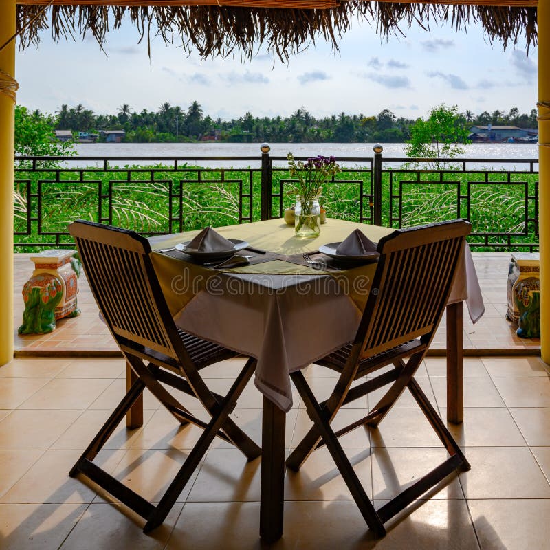 Beautiful view from table in Vietnamese restaurant to tributary river of Mekong River, near Ho Chi Minh City, Vietnam royalty free stock photo Beautiful view from table in Vietnamese restaurant to tributary river of Mekong River, near Ho Chi Minh City, Vietnam royalty free stock photo