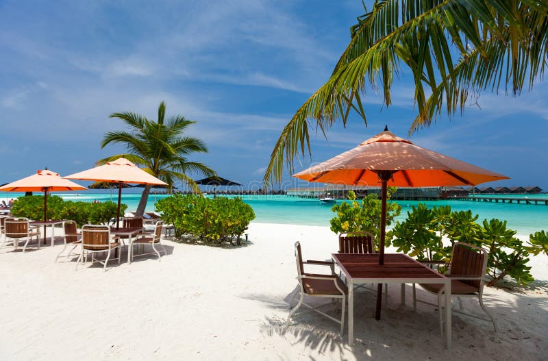 Tables at beach restaurant stock photo. Image of table 41668952