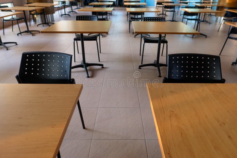 Tables and Chairs that is Arranged Spaced or Social Distancing in the