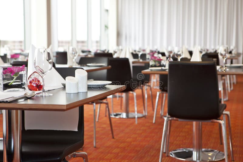 Tables with formal setup in modern restaurant