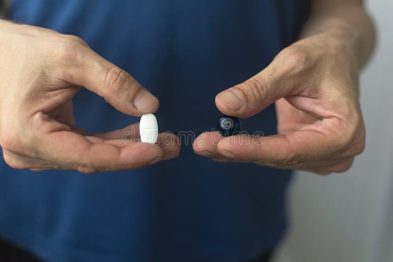 Tablet and Bilberry in the Hands Stock Image Image of vitamins
