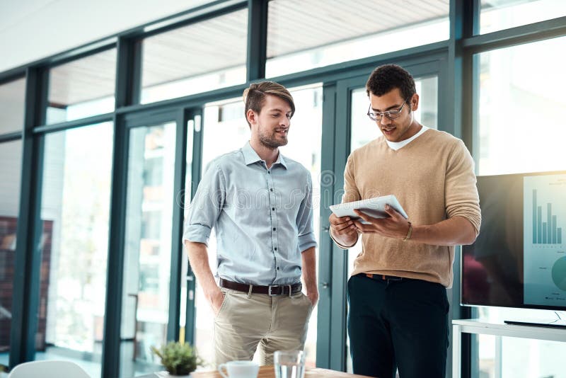 Tablet, business men and digital planning for app developer project with website design ideas in office. Brainstorming stock image