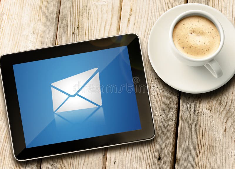 Tablet with coffee on table