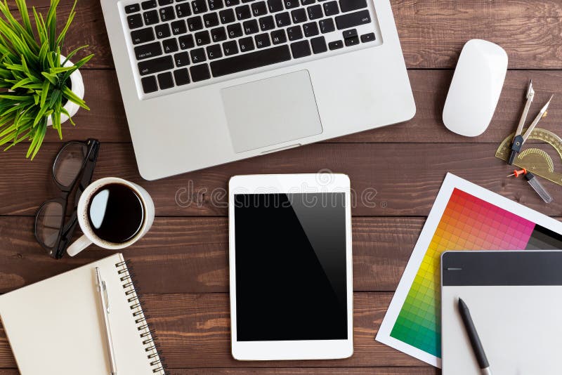 Tablet on creative workspace on top view royalty free stock photography