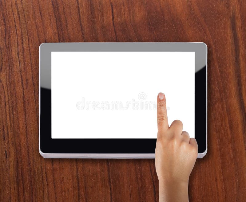 Modern tablet device over wooden background with index finger touching screen. Modern tablet device over wooden background with index finger touching screen