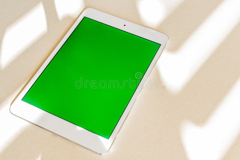 Tablet with Green Screen on a Desk Copy Space, Technology Concept