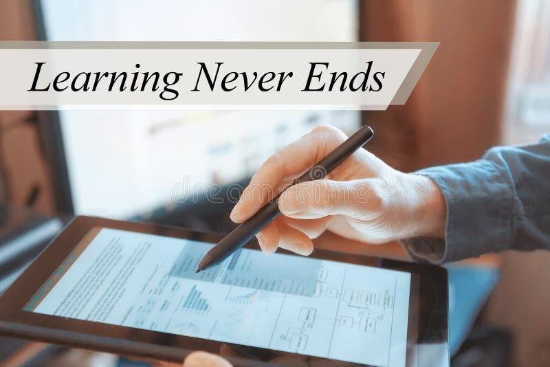 The tablet in the hands of a businessman. Learning Never Ends concept royalty free stock photos